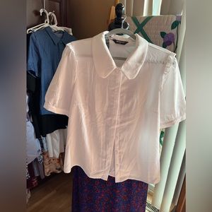 Allegra K light cream blouse with a ruffle sewn along puffy sleeves as accent.